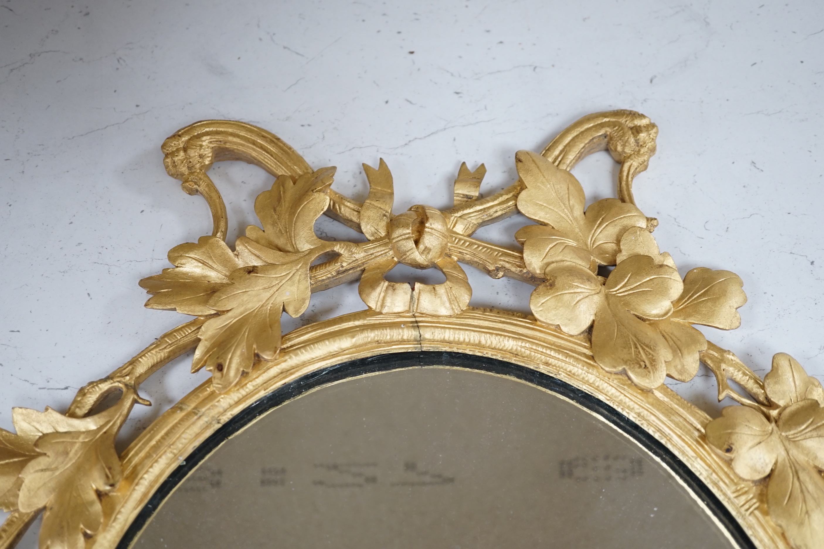 A Victorian carved gilt wood framed wall mirror, 66x50cm